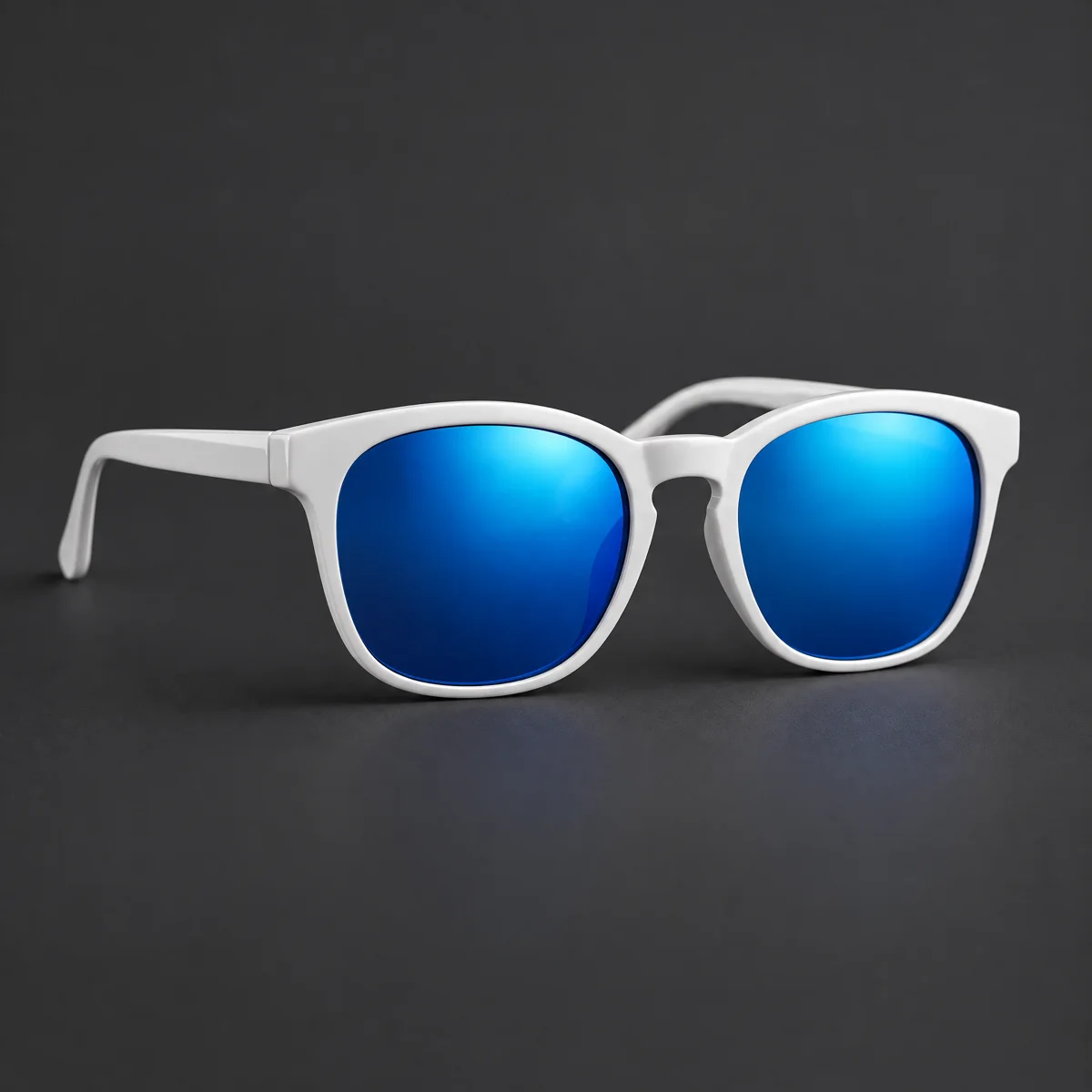 Product photo of the same sunglasses shape in glossy white acetate with blue mirrored lenses on dark grey